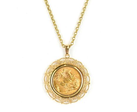 A George V 1925 full sovereign in a 9ct gold circular pendant mount with open scrollwork, suspended on a 9ct gold dainty belc