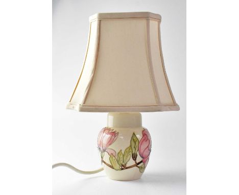 MOORCROFT; a 'Magnolia' pattern ginger jar shaped table lamp of shouldered tapering form, with impressed green marks, height 
