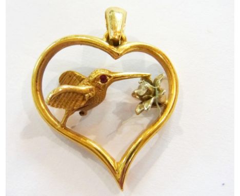 18K gold ruby and diamond pendant in the form of hummingbird with ruby set eye hovering over a flower centred by tiny diamond
