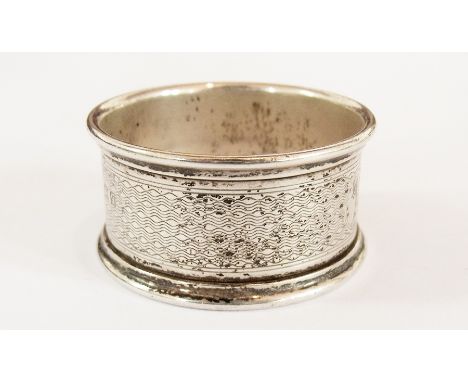 A 19th century silver napkin ring of engine-turned decoration and having engraved "L", Birmingham 1915 