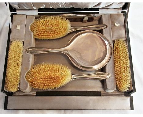 Early 20th century silver dressing table set of plain ridged rim form, comprising two rectangular hairbrushes, comb and hand 