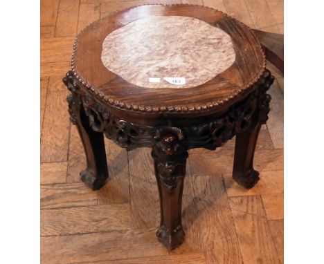 Chinese carved rosewood table/jardiniere stand, the shaped circular top inlaid with marble and having beaded border, scroll a