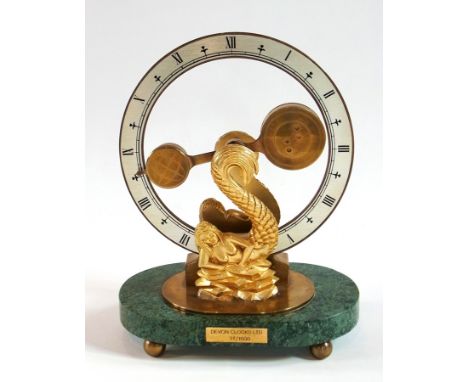 Devon Clocks Limited, mystery mantel clock having silvered chapter ring with brass pendulum movement supported by two mermaid