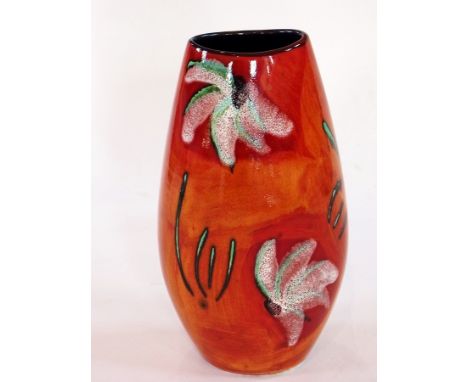 A Poole pottery Delphis vase, artist's signature, decorated with a floral pattern, 27cm high 