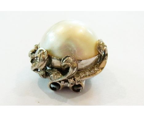 Large pearl and diamond brooch, the single pearl set numerous tiny diamonds in scrolls and hoop, 2cm diameter 