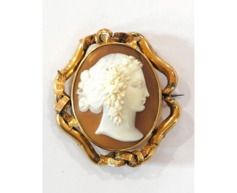 Victorian carved shell cameo brooch, oval with portrait of a lady with flower adorned hair, in rolled gold setting 
