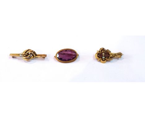 Amethyst and pearl brooch in flowerhead setting, oval amethyst brooch and a knot brooch 