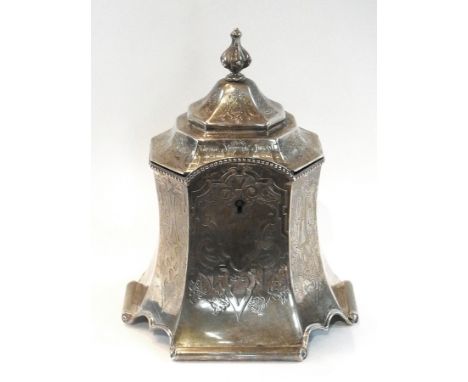 A Victorian silver tea caddy of raised octagonal waisted form, with bead borders and a strapwork engraving, raised on scrolle