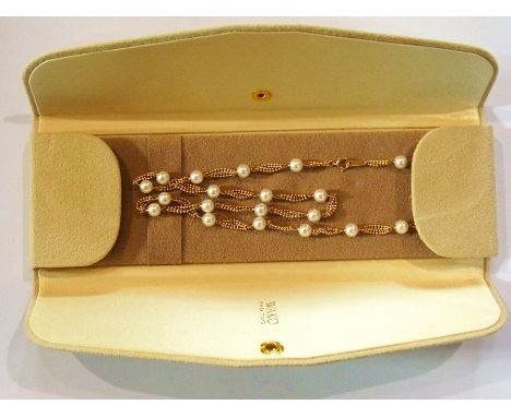 Wako Japanese 18ct gold and pearl necklace, four-strand beaded chain interspersed with full sized pearls (with certificate an