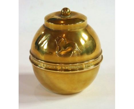 British Empire Exhibition 1924 brass Lipton tea caddy, circular lidded form, 13cms high