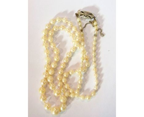 Simulated pearl necklace with white gold-coloured metal clasp marked 9ct, having central rose cut diamond 