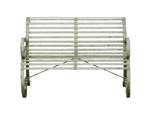 A 20th century white painted wrought iron garden bench on scroll supports, 122cm wide.   Illustrated
