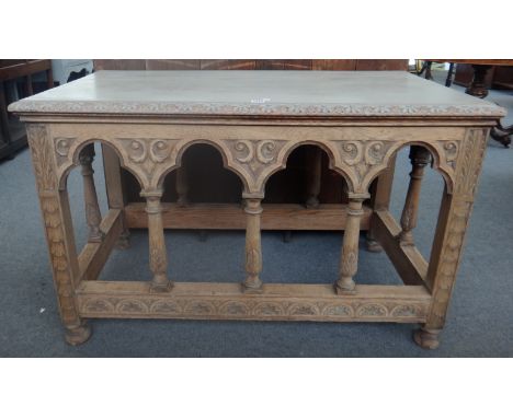 A 19th century oak rectangular centre table with Gothic arch frieze, 123cm wide.