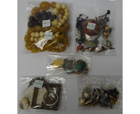 A group of jewellery, comprising; a bloodstone and agate set rotating pendant locket fob, a circular carved coral brooch, wit