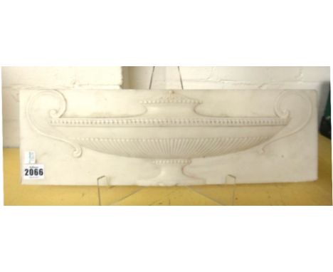 A marble chimneypiece tablet carved with an urn, 19th century, 46cm x 14.5cm.