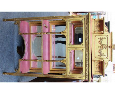 A 19th century gold painted shelf back side cabinet with glazed cupboards over open shelves, 70cm wide.