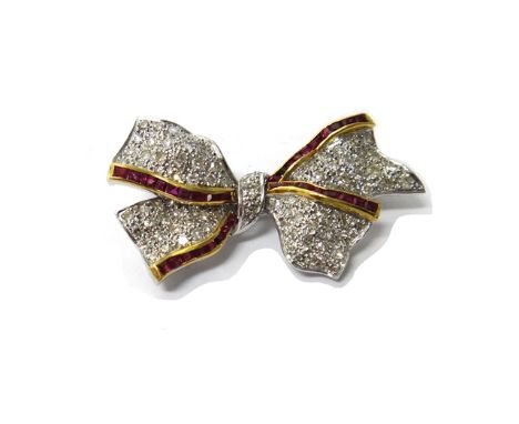 A yellow and white gold, diamond and ruby set brooch, designed as a ribbon tied bow, mounted with circular cut diamonds and w