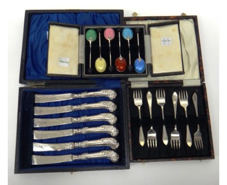 A set of six silver and vary coloured enamel coffee spoons, with black bean terminals to the handles, Birmingham 1955, cased,