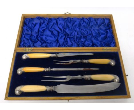 A late Victorian silver mounted five piece carving set, comprising;  a large knife and fork, a smaller knife and fork and a s