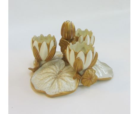 A Worcester white glaze centrepiece, late 19th century, modelled as a lilypad with four upturned flower heads, 16cm high, ano