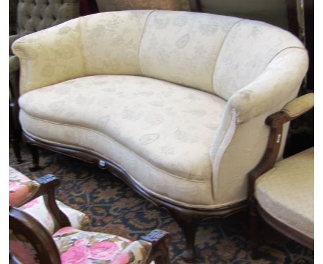 A 20th century kidney shaped sofa of George I design, on pad feet, 170cm wide.