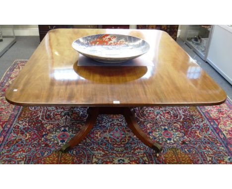 A George III rectangular mahogany snap top breakfast table on four downswept supports, 121cm wide x 153cm deep. 