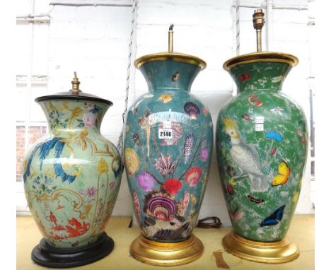 A Declomania glass lamp base of ovoid form, 20th century, decorated with seashells against a blue ground with giltwood mounts