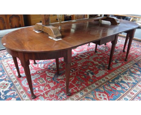 An 18th century and later mahogany 'D' end extending dining table, with drop flap centre section on pad feet, 121cm wide, eac