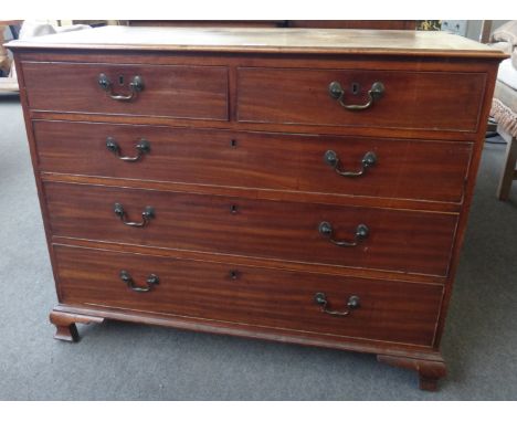 A George III mahogany chest of two short and three long graduated drawers, on ogee bracket feet, 114cm wide.