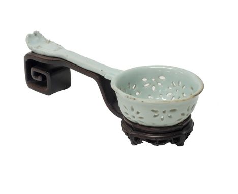 A rare Chinese pierced white-glazed porcelain ladle, Qianlong, the deep circular bowl pierced with flower motifs after a Euro