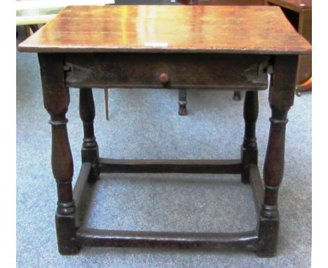 A 17th century oak single drawer side table on baluster supports, 66cm wide.