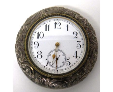 A late Victorian silver mounted circular travelling clock, the unsigned enameled dial with black Arabic numerals and with sub