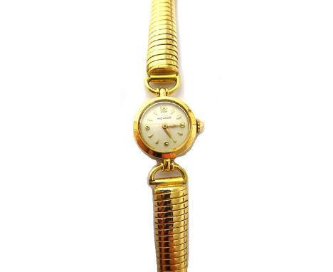 A lady's gold circular cased Movado bracelet wristwatch, the signed circular silvered dial, with gilt Arabic and arrow shaped