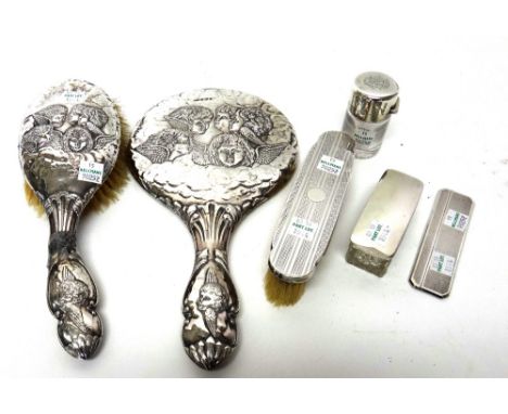 Silver mounted wares, comprising; a hand mirror, a hairbrush, a clothes brush, a travelling comb, a rectangular faceted glass