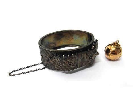 A Masonic spherical pendant fob, opening to reveal a variety of engraved Masonic symbols and a Victorian silver oval hinged b