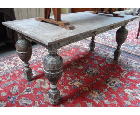 A 17th century design limed oak refectory table on bulbous supports, 80cm x 165cm. 