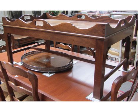 An 18th century style mahogany tray top rectangular coffee table on square supports, 107cm wide.