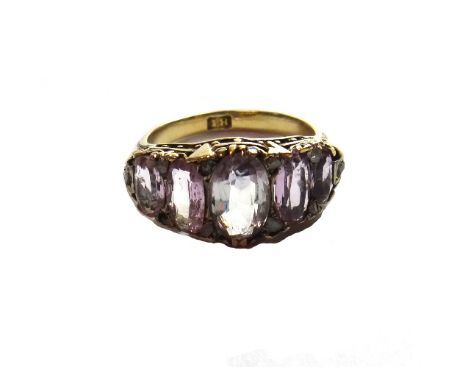 A gold, pale blue and pale mauve gem set five stone ring, mounted with graduated oval cut coloured gemstones and with rose di