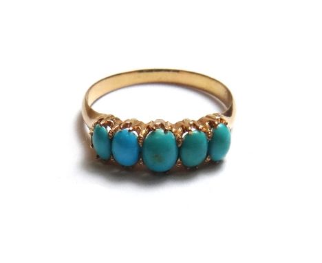 A gold and turquoise set five stone ring, mounted with a row of oval turquoise, detailed 18 C, ring size M and a half, with a