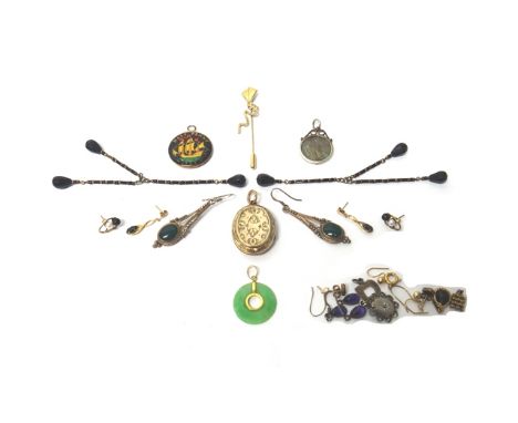 A group of jewellery, comprising; an oval gold back and front pendant locket, with engraved decoration, a circular jade penda