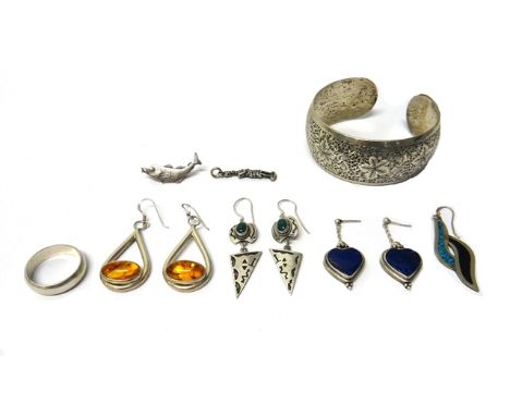 Mostly silver mounted jewellery, comprising; an Eastern bangle, decorated with birds and leaves, three pairs of earrings, one
