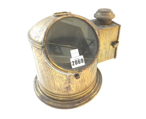 A Sestrel gimbal mounted ships compass, early 20th century, housed within a gilt metal binnacle hood with oil lamp to one sid