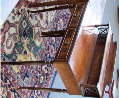 A George III style mahogany ledge back two drawer writing table on reeded supports, 86cm wide. 