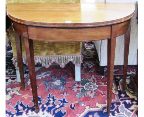 A George III inlaid mahogany card table on tapering square supports, 91cm wide. 145