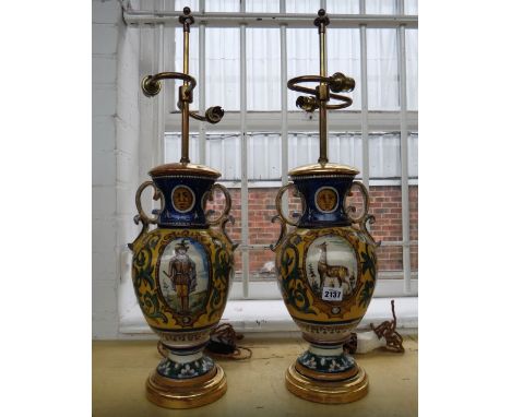 A pair of French faience two handled vase lamp bases, 20th century, each of urn form, with giltwood mounts, vase 35cm excludi