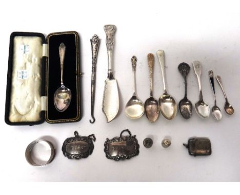 Silver and silver mounted wares, comprising; a large King's pattern butter knife, two decanter labels, detailed Brandy and Wh