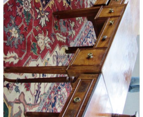 An 18th century rectangular mahogany three drawer writing table on block supports, 99cm wide. 159