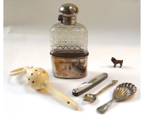 An Austrian cold painted miniature pug dog, early 20th century, a cut glass and silver plated hip flask, a turned ivory teeth