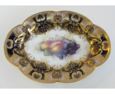 A Royal Worcester lobed oval dessert dish by Richard Sebright, circa 1920, painted with a group of fruit and flowers, signed 