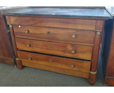 An early 19th century gilt metal mounted marble topped mahogany four drawer commode with split turned decoration, 131cm wide.